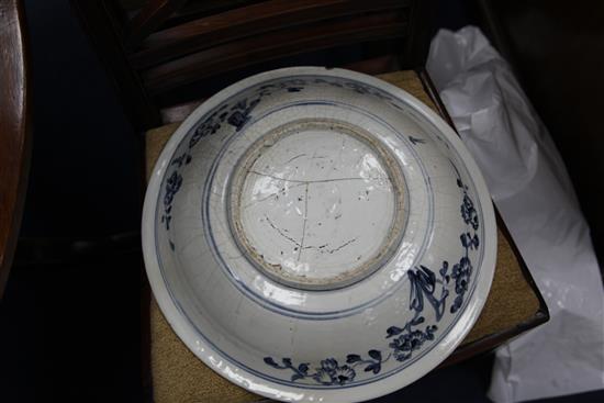 An Annamese blue and white dish, 15th / 16th century, 43cm, various cracks, rosewood stand